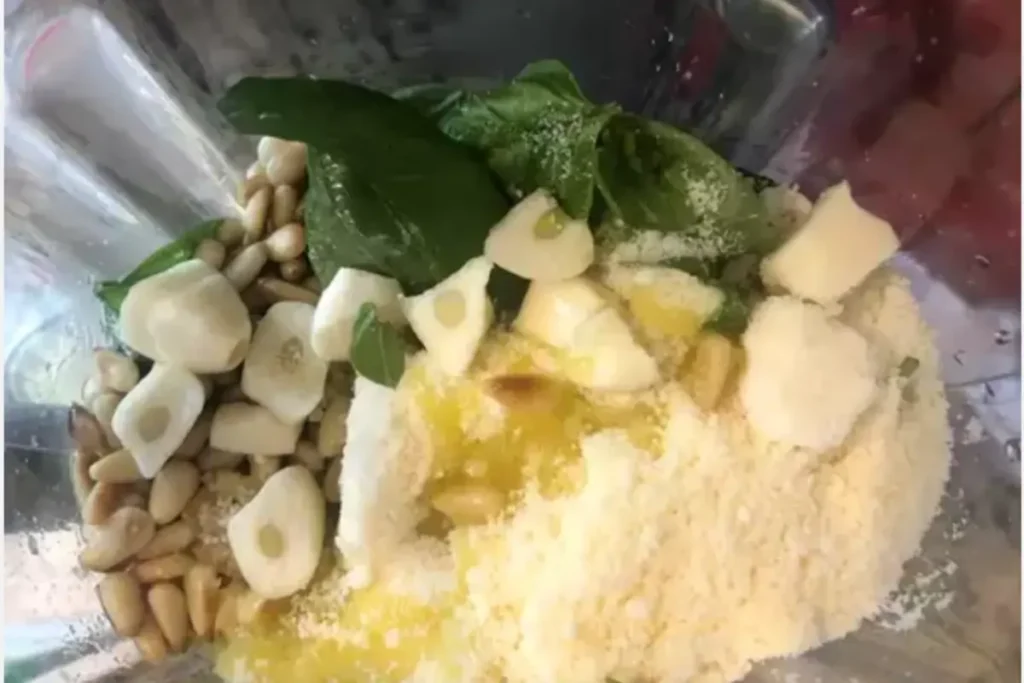 Ingredients for pesto sauce in a blender